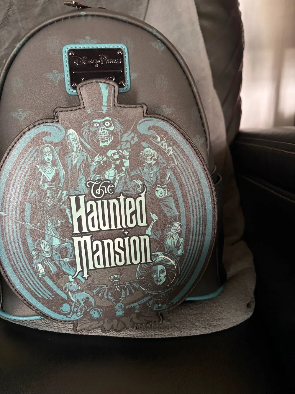 Loungefly Haunted Mansion Glow in the Dark Mini Backpack in Black and Teal